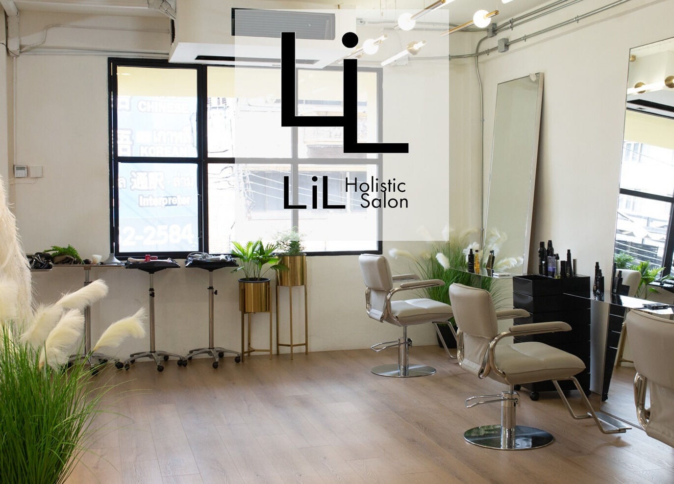 Elegant interior of Lil Holistic Salon in Krung Thep Maha Nakhon with chic decor and styling chairs.