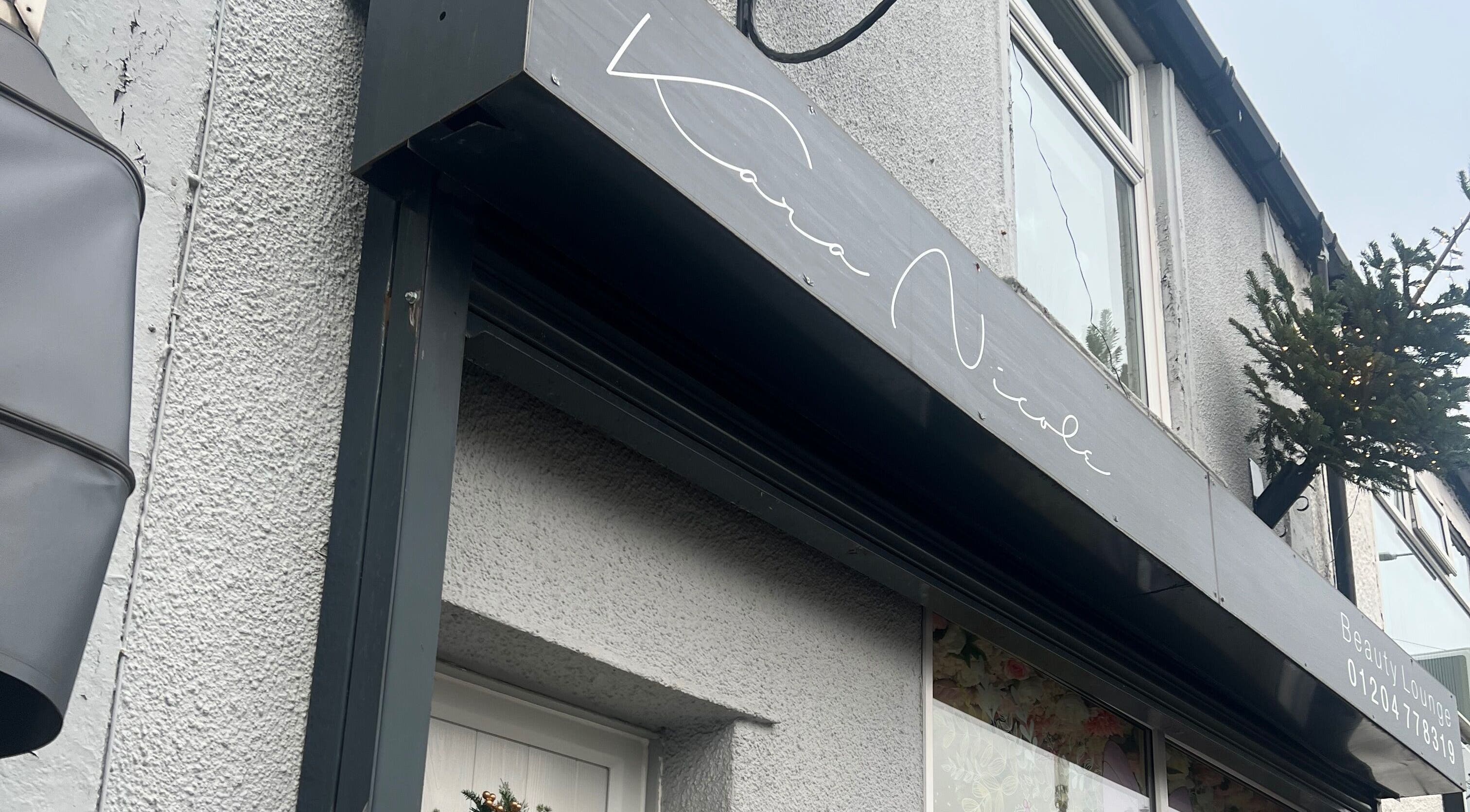 Beauty with Beth salon entrance in Bolton, England, GB with elegant signage.