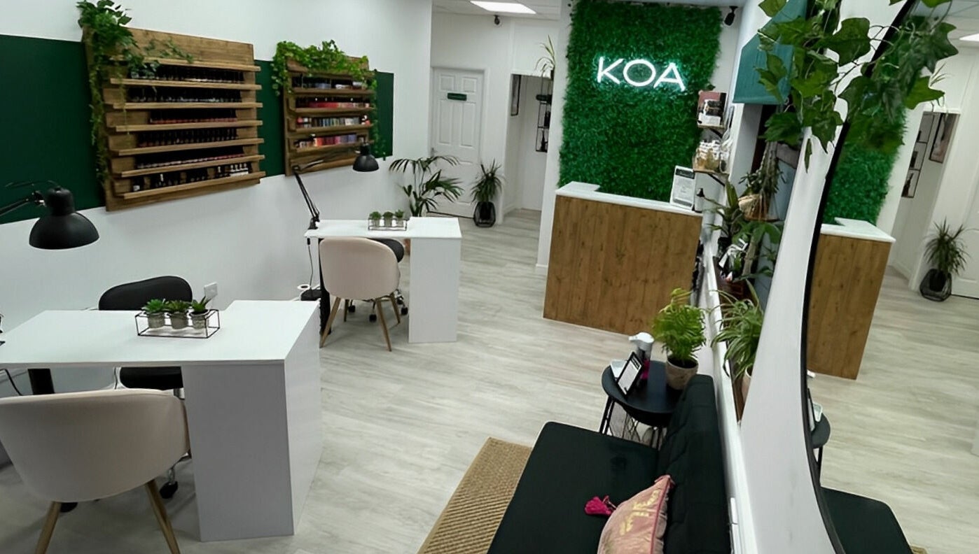 Chic interior of KOA Beauty Lounge LTD, Crapstone, England, GB, showcasing stylish decor and manicure stations.