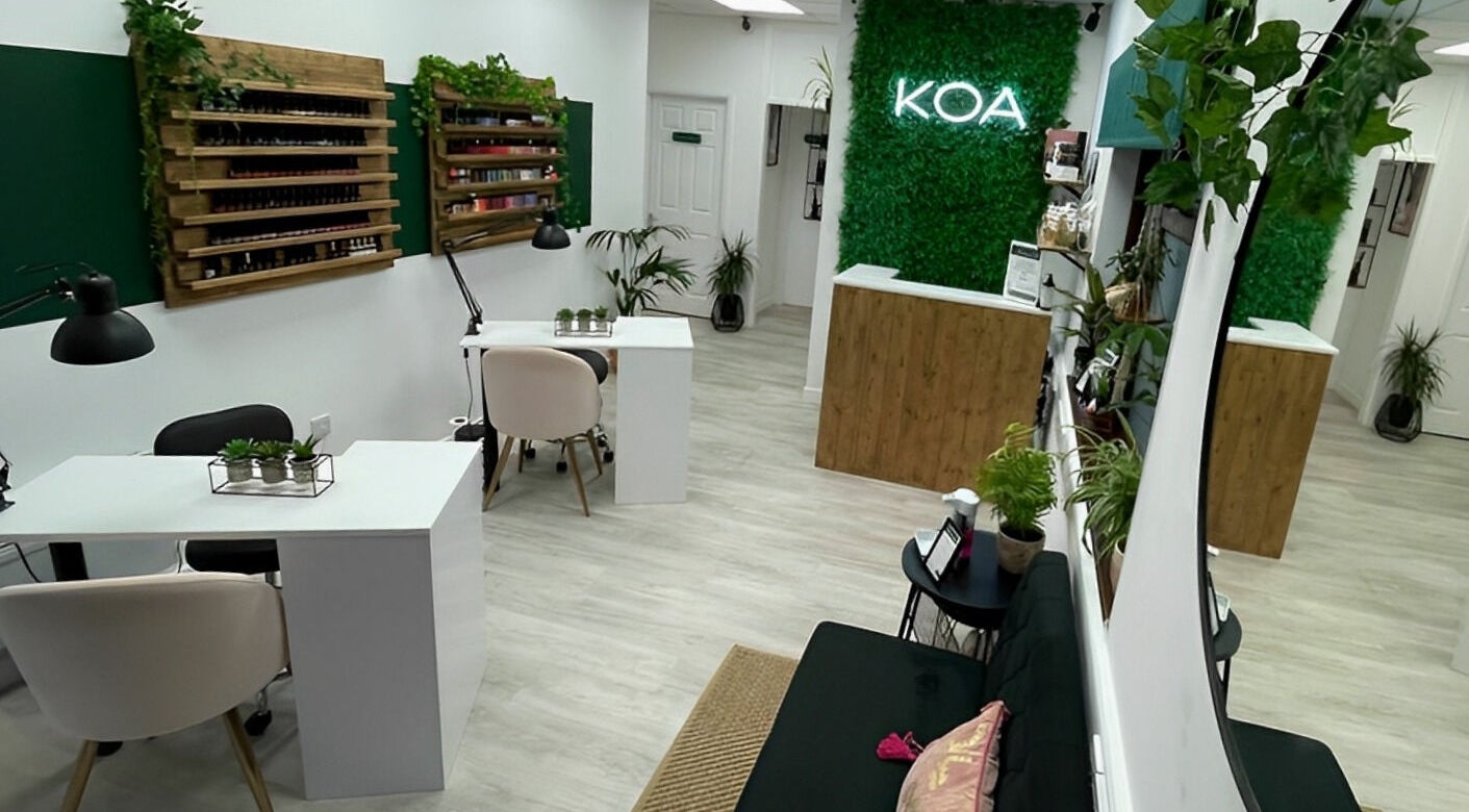 Chic interior of KOA Beauty Lounge LTD, Crapstone, England, GB, showcasing stylish decor and manicure stations.