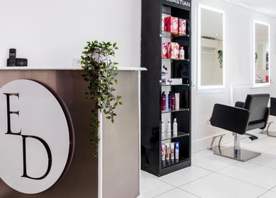 Elliott Dean salon reception and styling chairs in Romford, England, GB with sleek modern design.