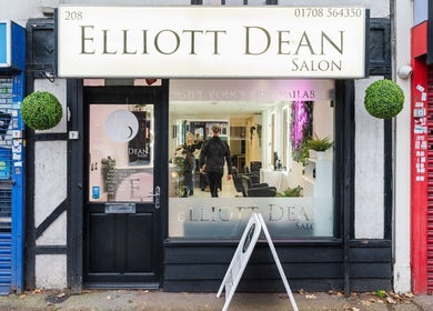 Exterior of Elliott Dean salon in Romford, England, showcasing modern design with welcoming atmosphere.