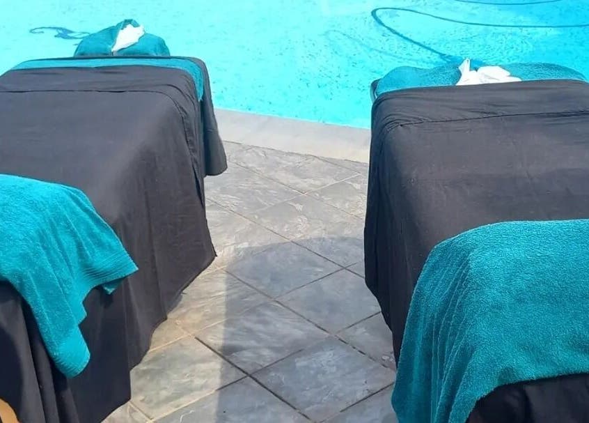 Relaxing poolside massage setup at Mello's Mobile Beauty Spa, Gqeberha, Eastern Cape, ZA.