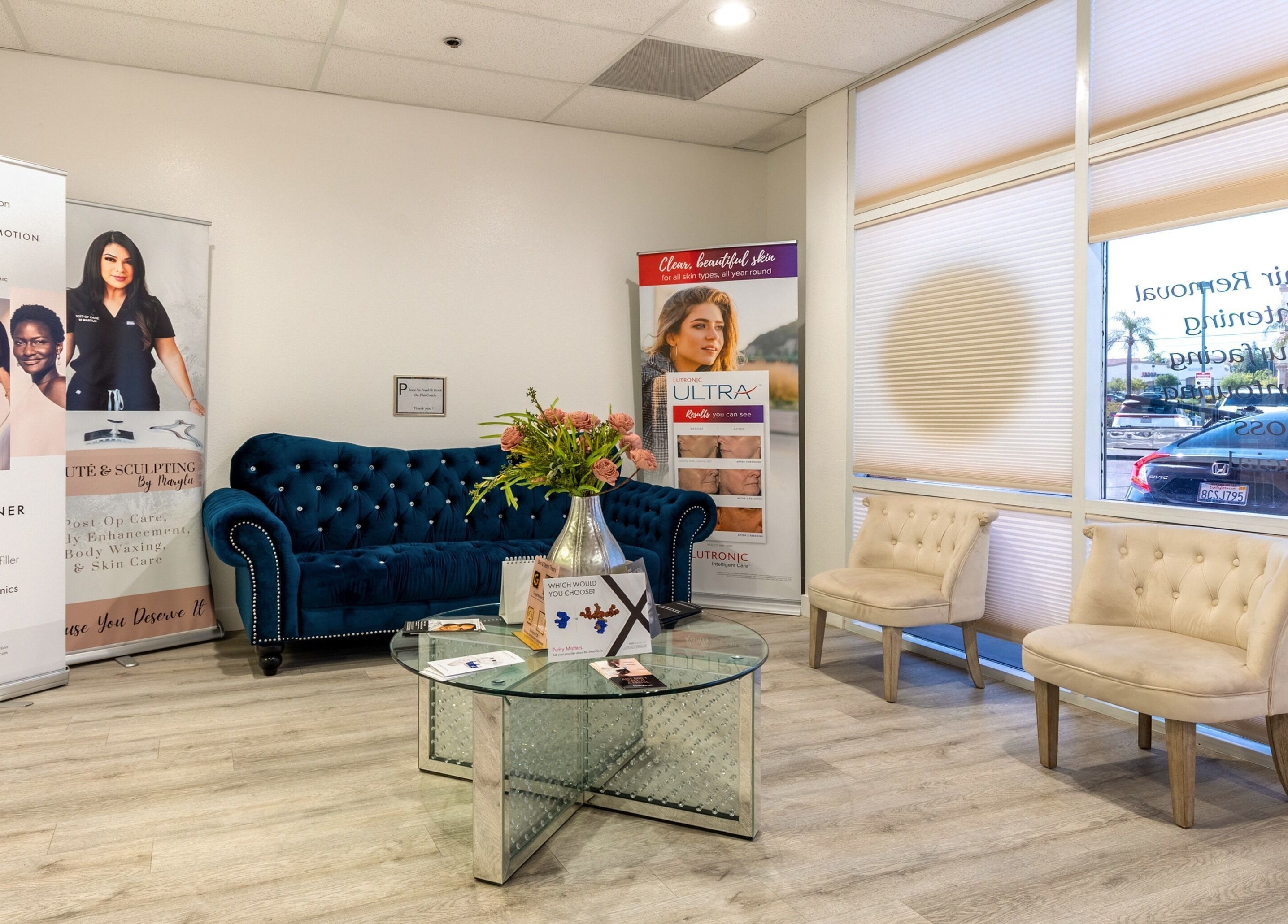 Just Be Skin Day Spa inviting lounge area in Riverside, California, US with plush seating and elegant decor.