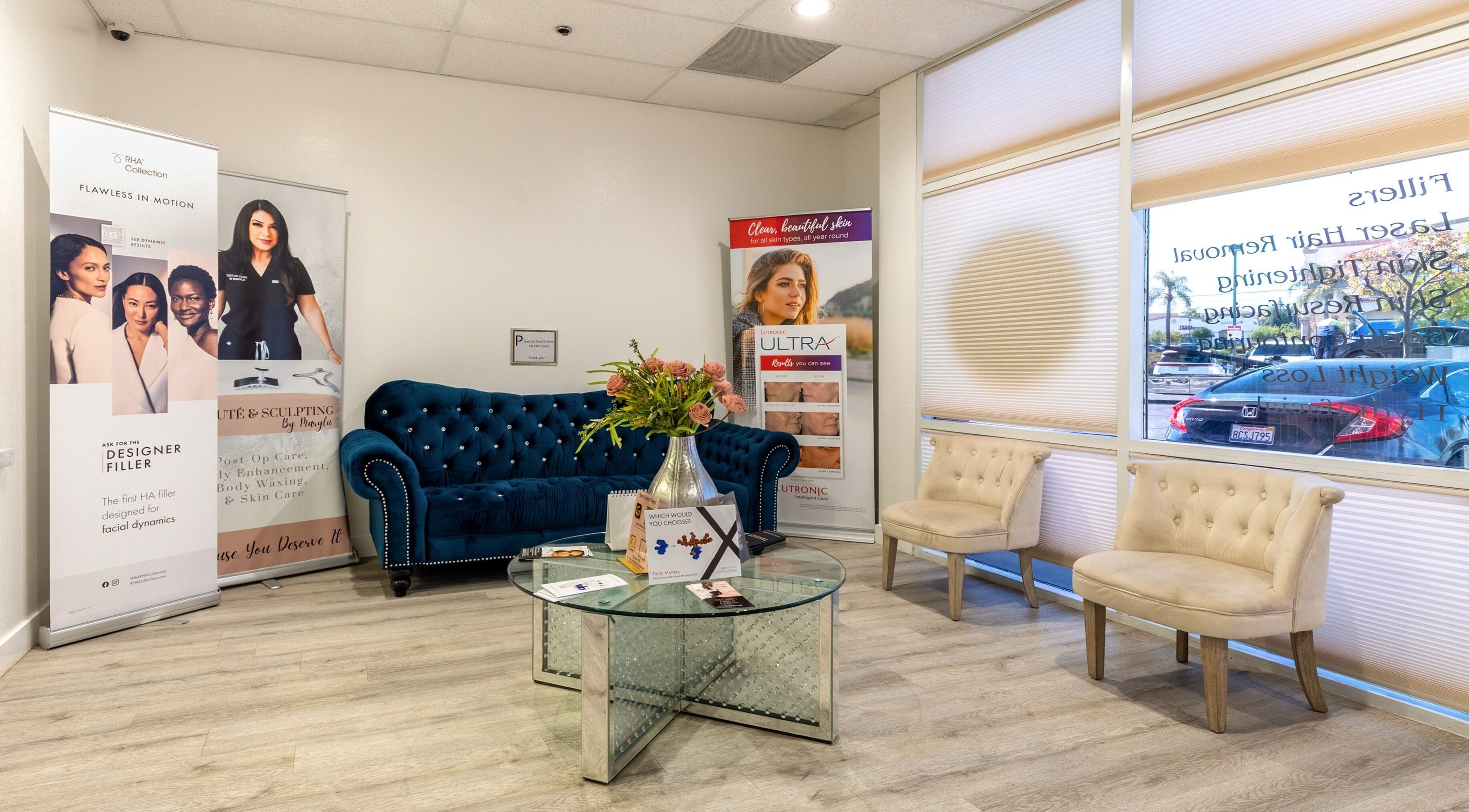 Just Be Skin Day Spa inviting lounge area in Riverside, California, US with plush seating and elegant decor.