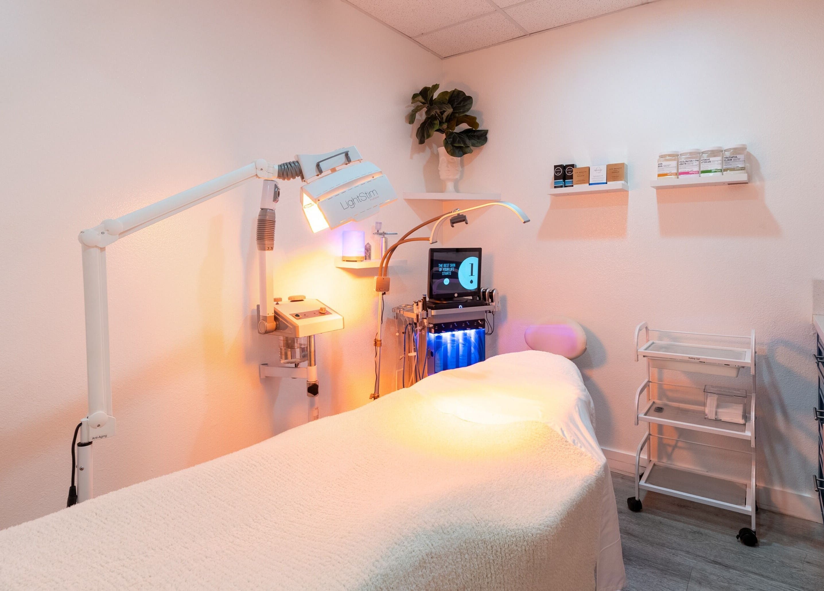 Tranquil treatment room at Just Be Skin Day Spa, Riverside, California, US featuring advanced skincare equipment.