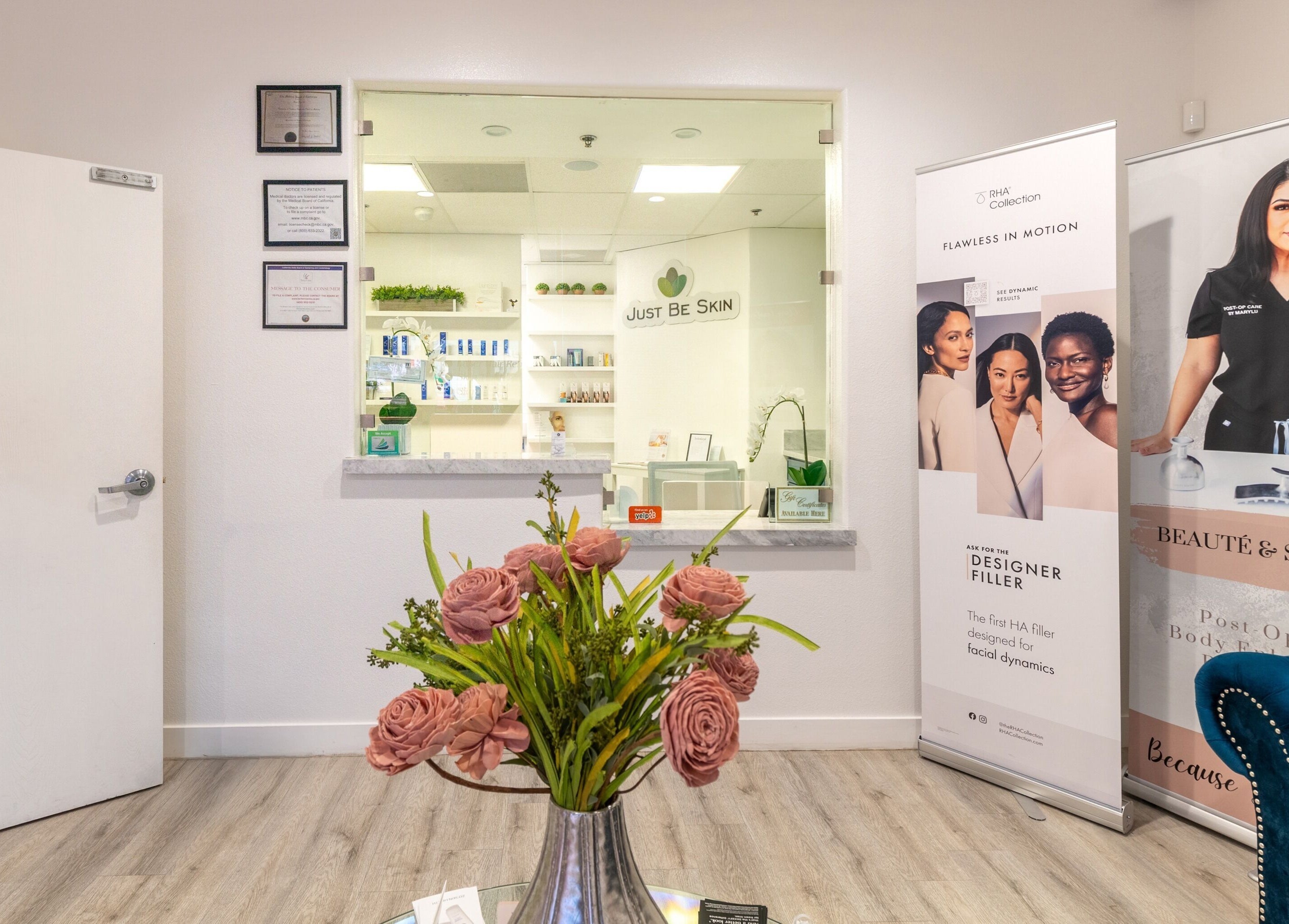 Just Be Skin Day Spa reception area in Riverside, California with elegant floral decor.