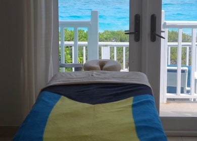 Massage table with ocean view at Lotus Relaxation Oasis 242, Nassau, New Providence, BS.