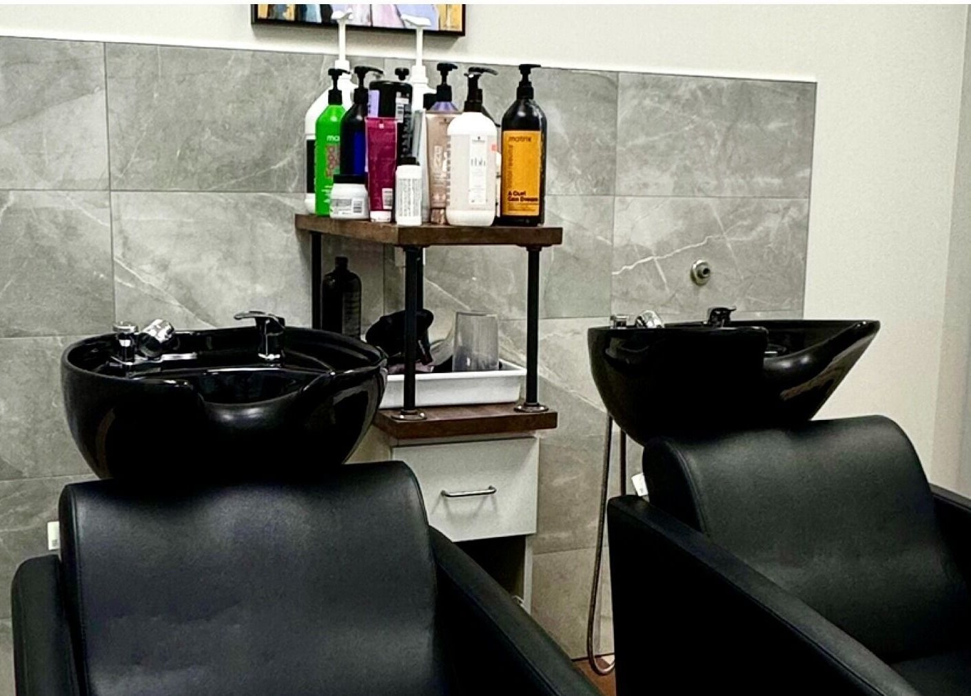 Modern wash stations at Krystel MediSpa & Salon in Dieppe, New Brunswick, CA for a luxurious hair care experience.
