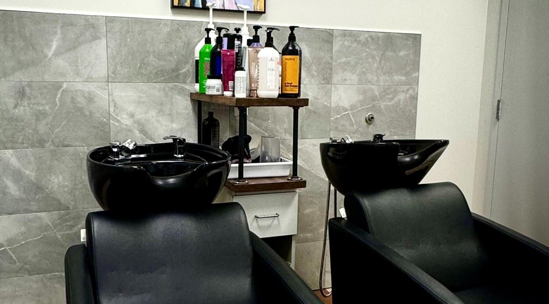 Modern wash stations at Krystel MediSpa & Salon in Dieppe, New Brunswick, CA for a luxurious hair care experience.