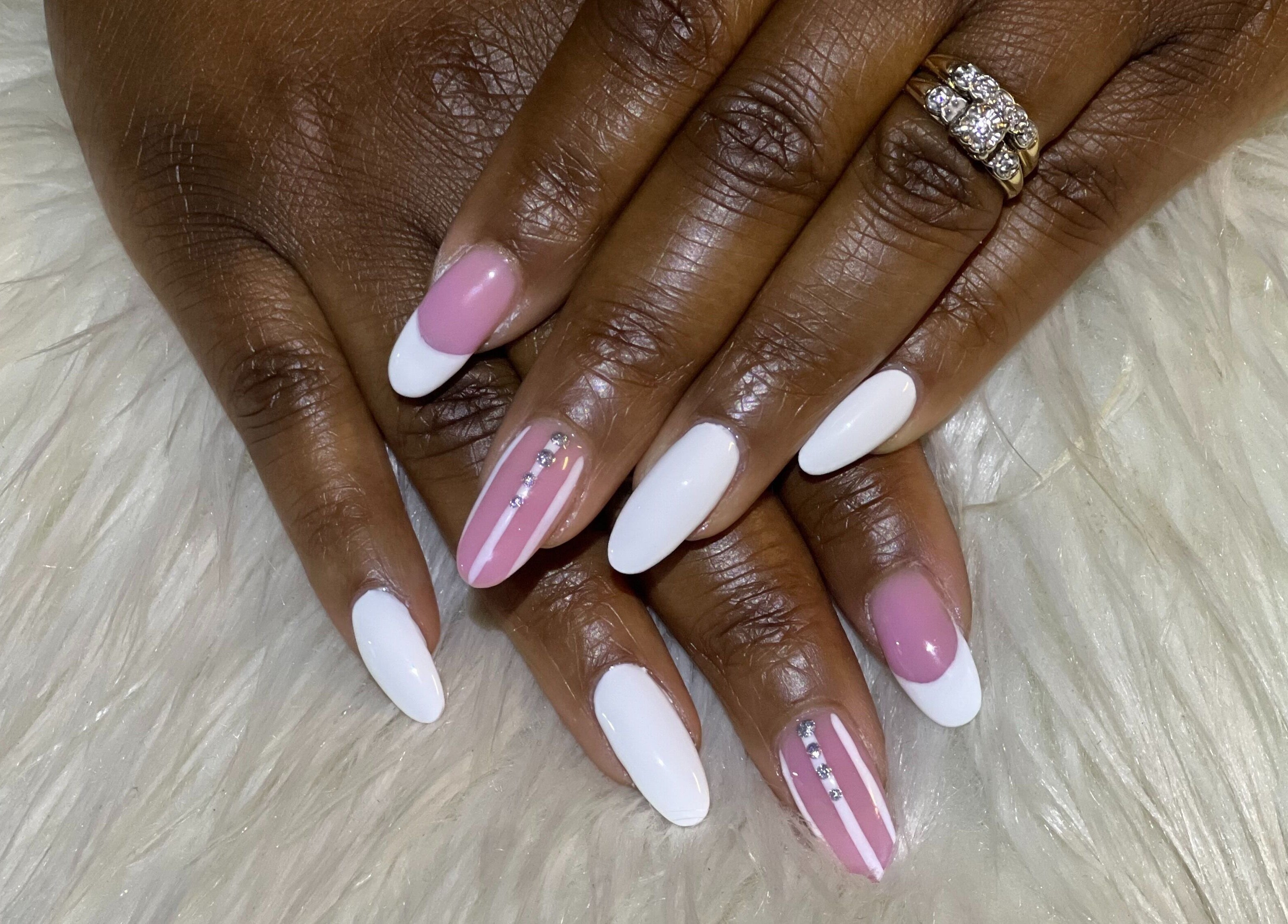 Elegant pink and white nail art with gems at Nail Anatomy - Mobile, Stockbridge, Georgia, US.