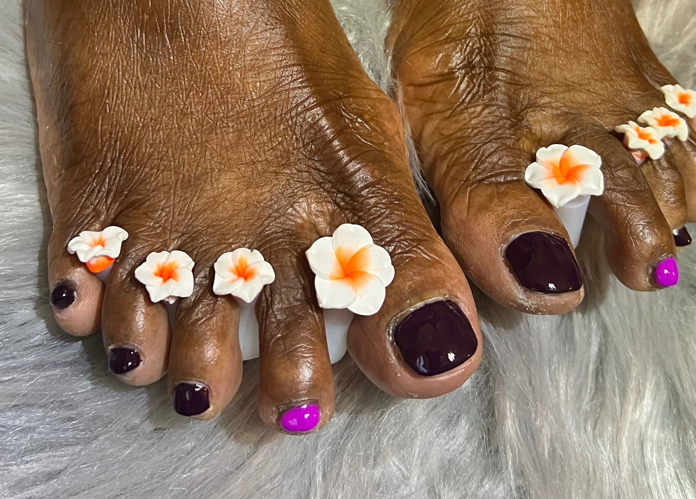 Elegant floral pedicure at Nail Anatomy - Mobile in Stockbridge, Georgia, US, showcasing beautiful nail art.