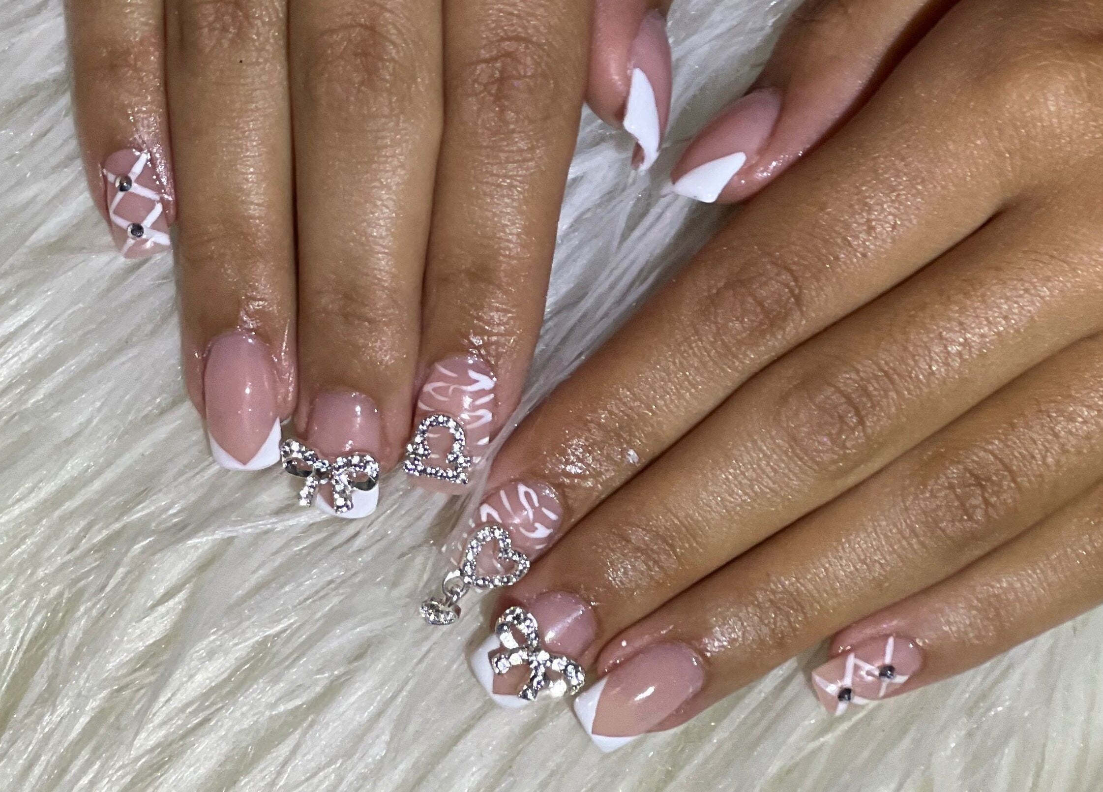 Intricate nail art design with rhinestones at Nail Anatomy - Mobile, Stockbridge, Georgia, US.
