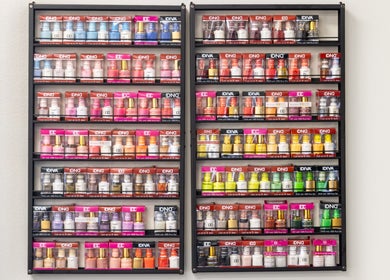 Colorful nail polish display at Nail Anatomy - Morrow in Morrow, Georgia, US showcasing a spectrum of shades.