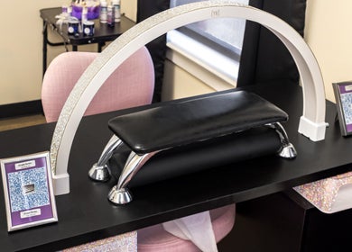 Elegant nail table setup at Nail Anatomy - Morrow, Morrow, Georgia, US, featuring stylish decor and tools.