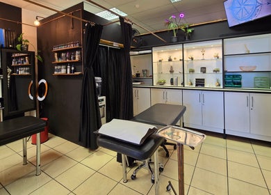 Interior of Assari Tattoo Studio, Johannesburg, Gauteng, ZA, showcasing professional tattoo workspace.