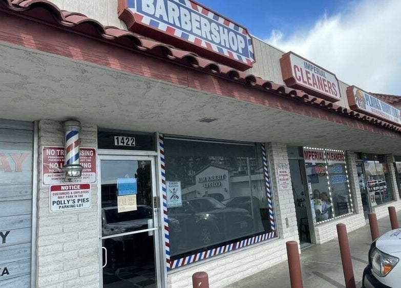 The Checkmate Barbershop entrance in Montebello, California, US, featuring a classic barbershop pole.