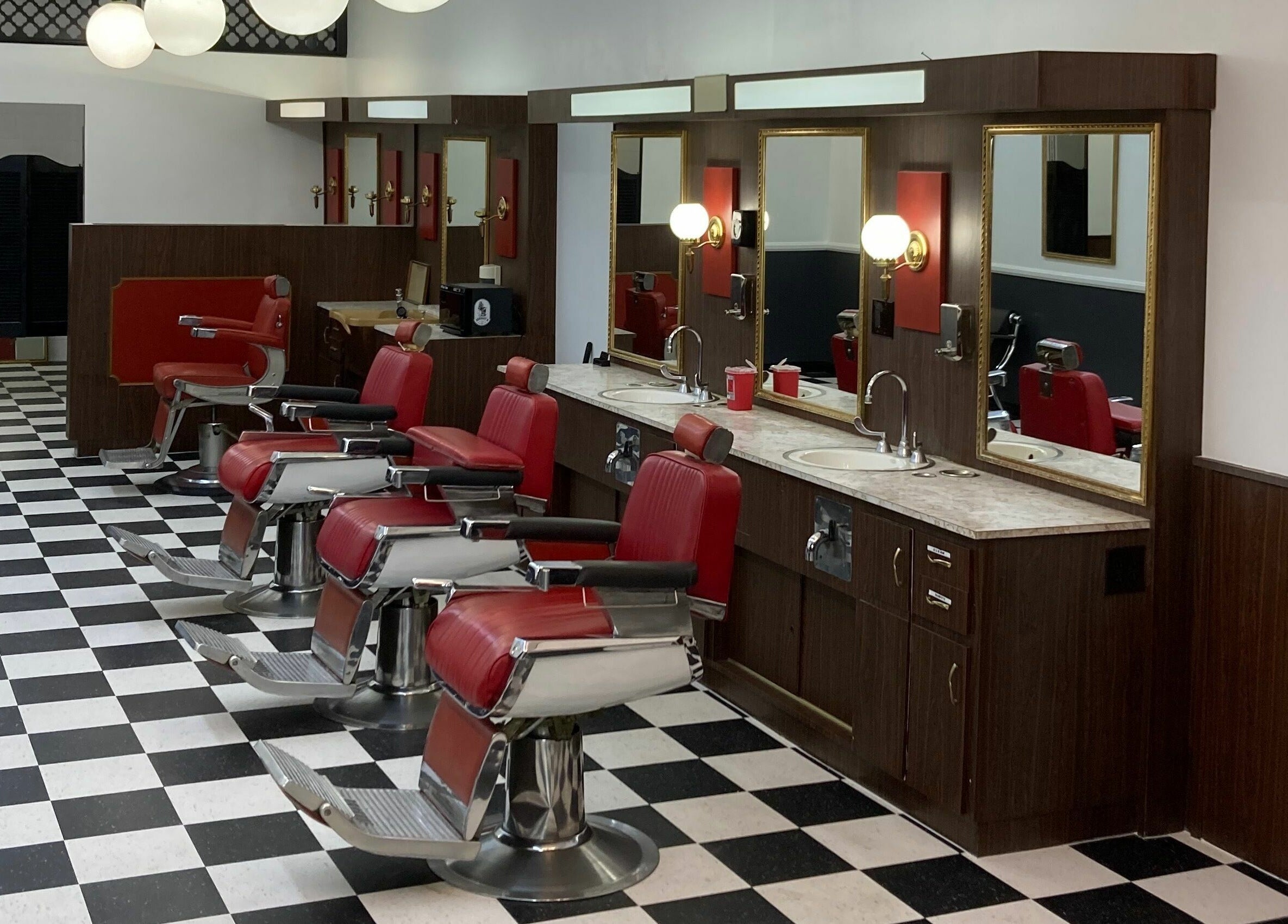 Vintage-style barber chairs at The Checkmate Barbershop in Montebello, California, US.