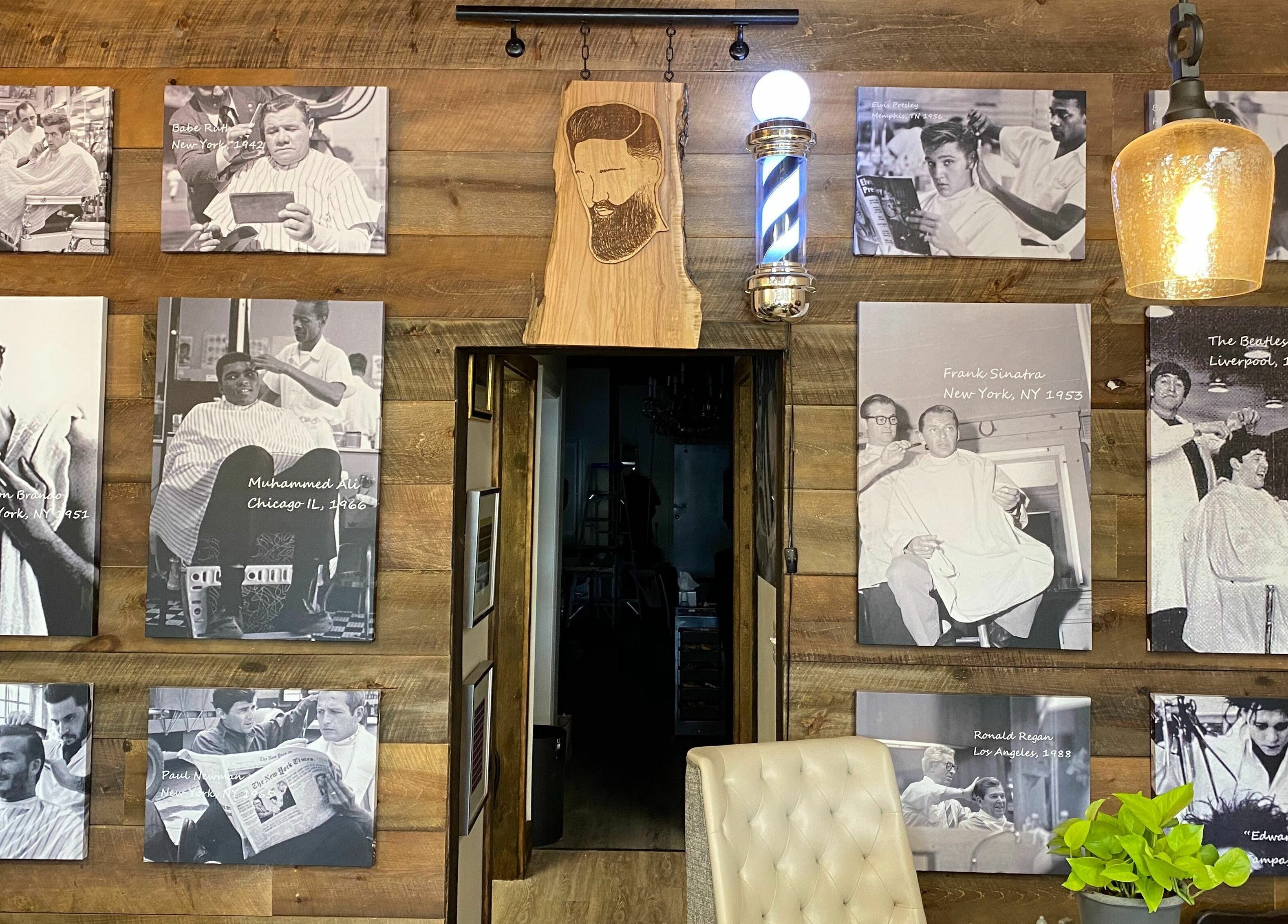 Wall of classic celebrity photos at Slek Hair Studio, Florham Park, New Jersey, US, showcasing vintage style.