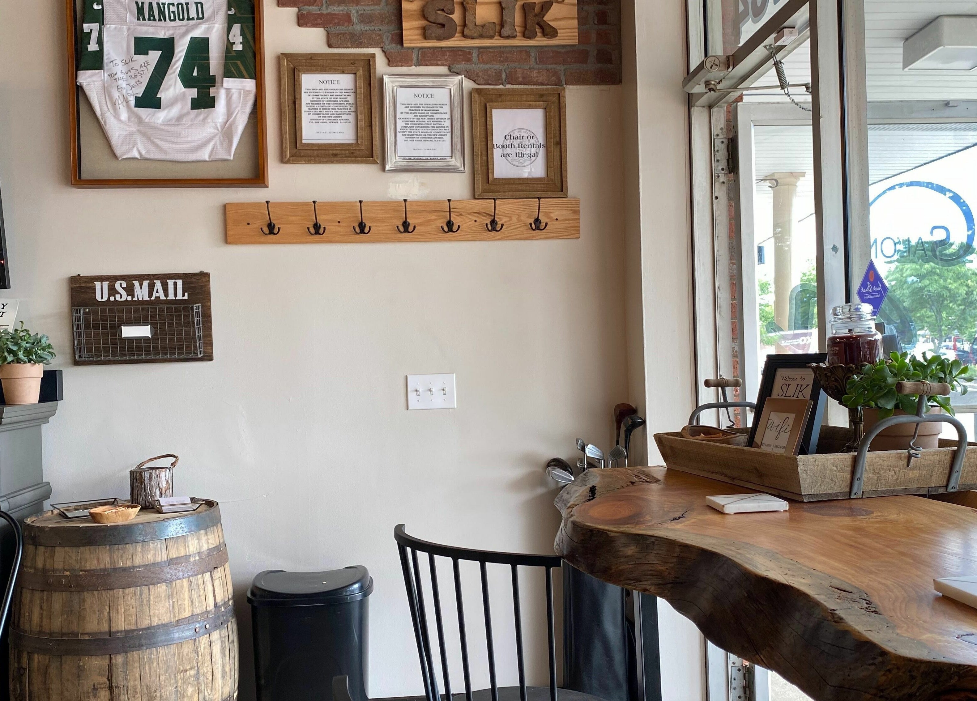Stylish interior of Slek Hair Studio, Florham Park, New Jersey, US featuring rustic decor and vibrant ambiance.
