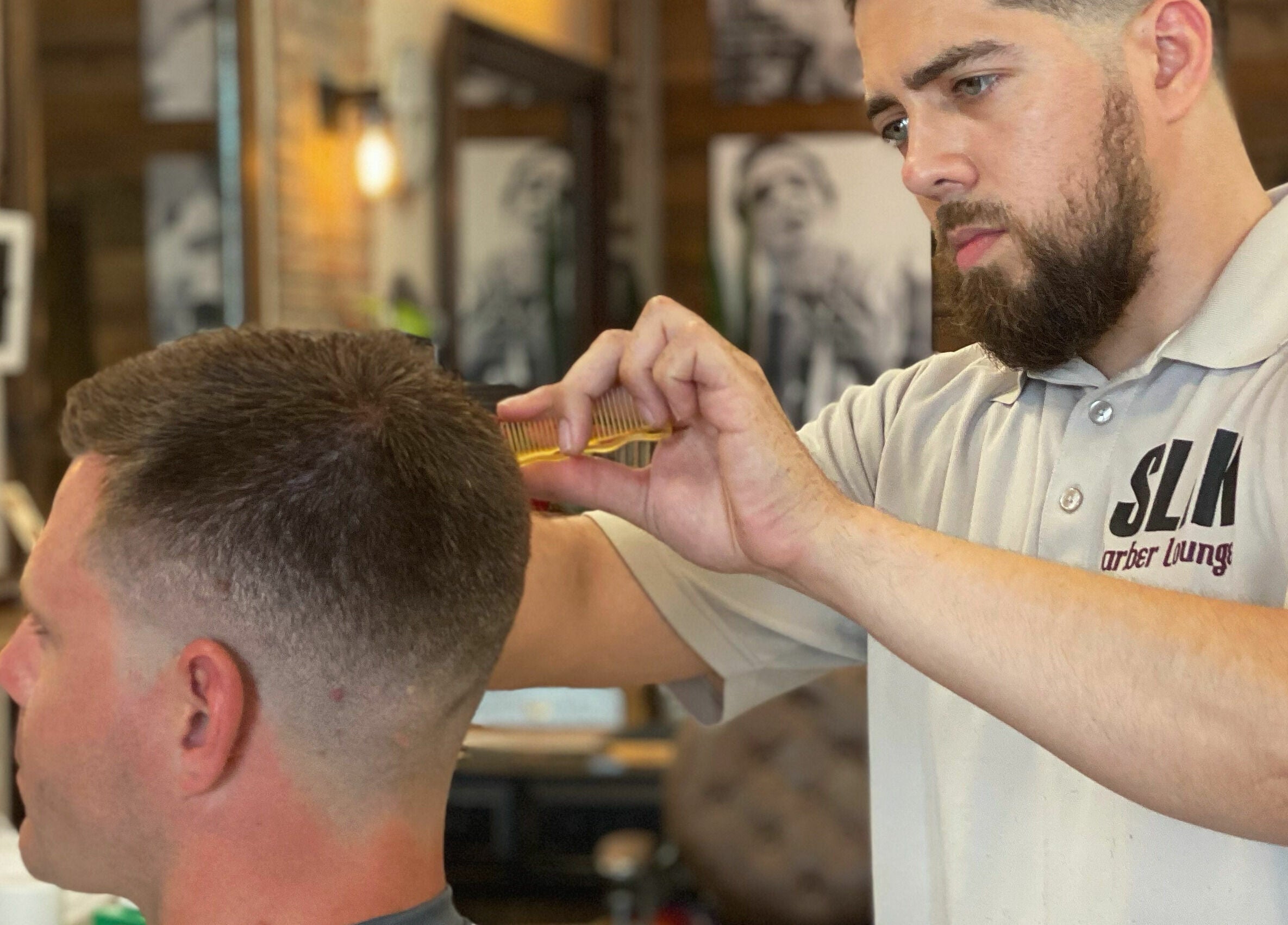 Stylist creating a precise haircut at Slek Hair Studio, Florham Park, New Jersey, US.