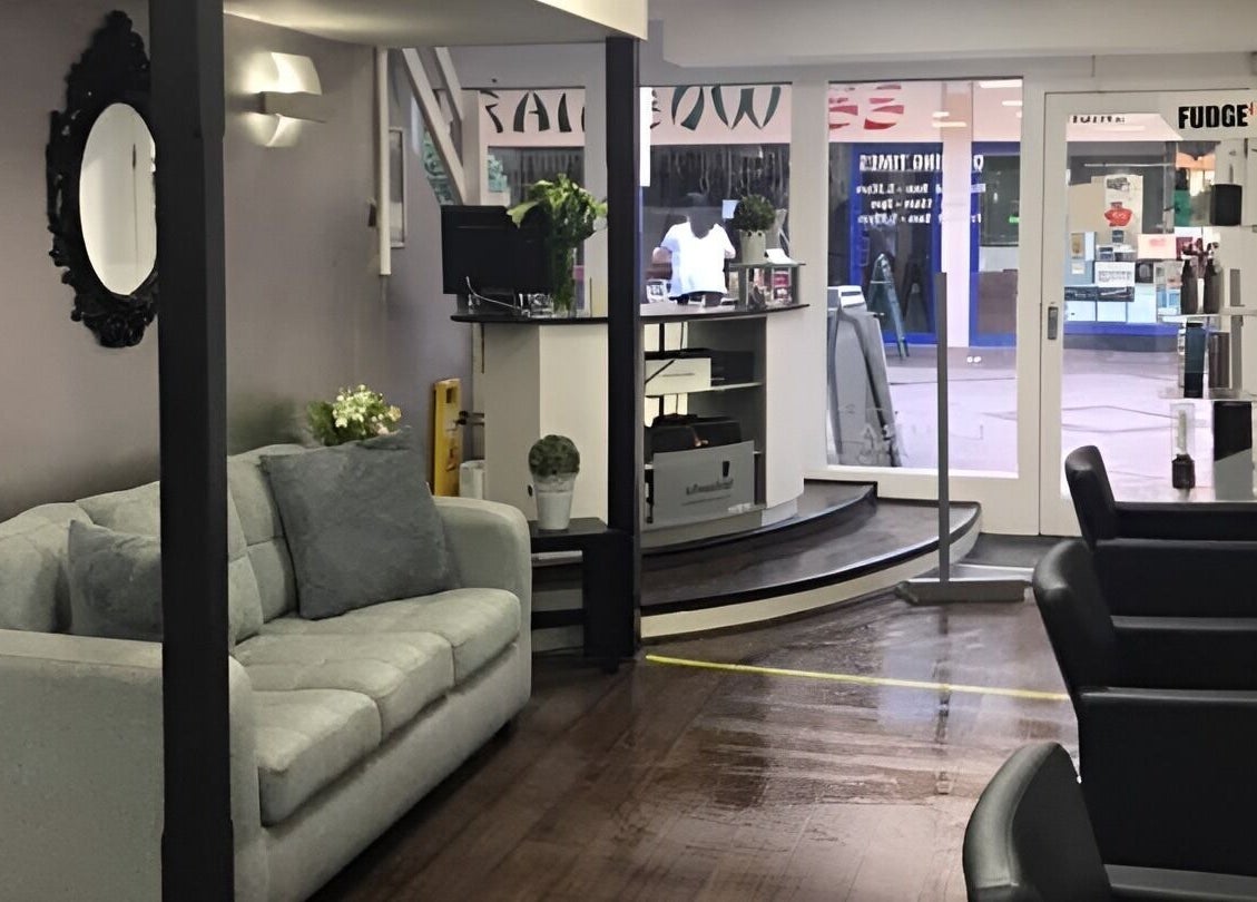 Stylish interior of Laura Caroline Hairdressing in Cheadle Hulme, England, GB featuring modern furniture.
