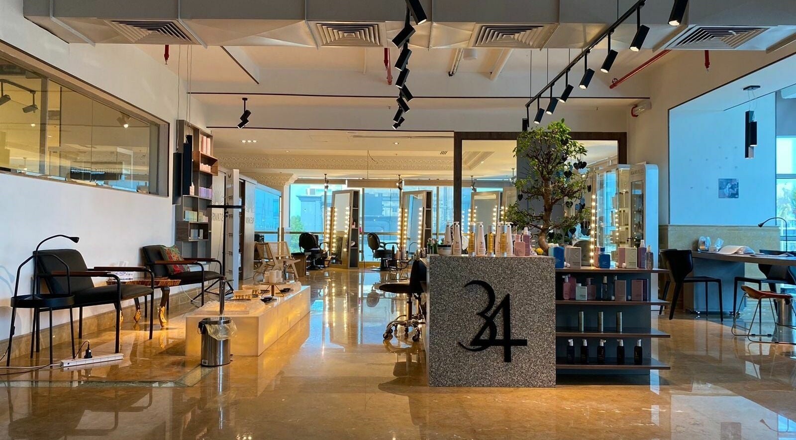 Stylish interior of 34 Beauty Lounge in Al Khobar, Eastern Province, SA, featuring modern decor and hair styling stations.