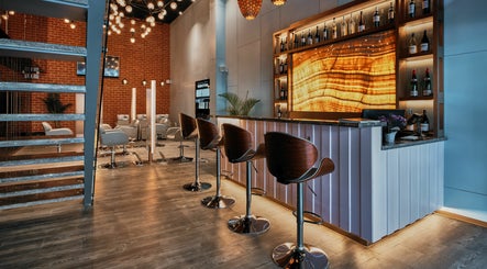 Chic interior of Blown - Salon - Vittal Mallya Road, Bangalore, Karnataka, IN with stylish chairs and lighting.