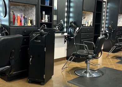 Interior of Hair By Kelli Megan the Urban Edge Salon in Loves Park, Illinois, US featuring stylish salon chairs.