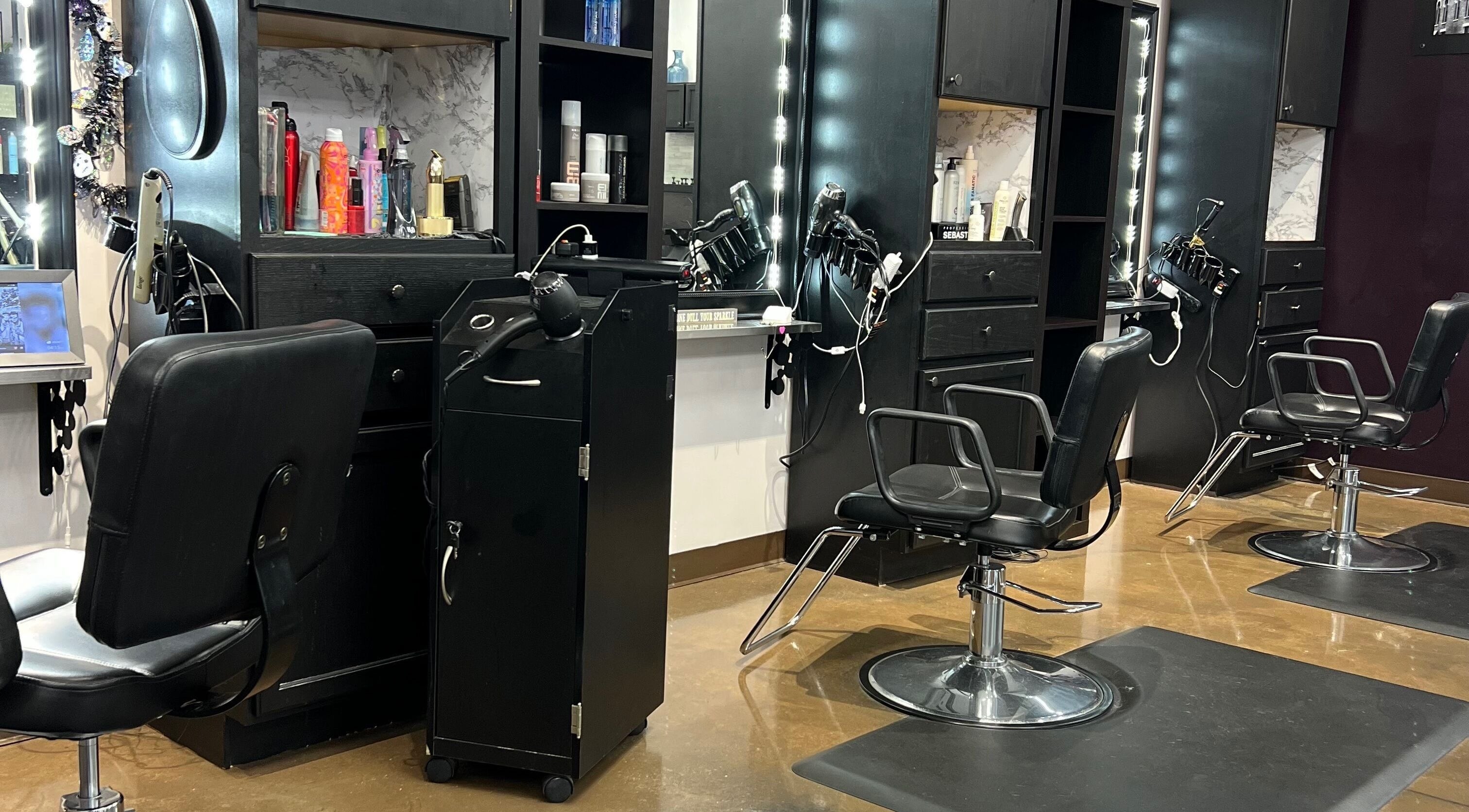Interior of Hair By Kelli Megan the Urban Edge Salon in Loves Park, Illinois, US featuring stylish salon chairs.
