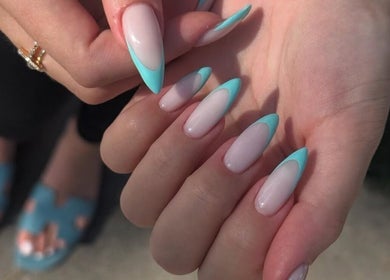 Elegant turquoise-tipped nails at Studio Nail Bar, Burbank, California, US offer chic style for trendsetters.
