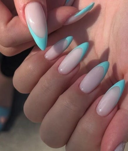 Elegant turquoise-tipped nails at Studio Nail Bar, Burbank, California, US offer chic style for trendsetters.