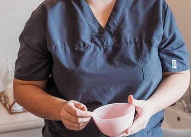 Beauty therapist at Rose Lounge Boutique - Book with Ashley in Somerset West, Western Cape, ZA, preparing treatment.