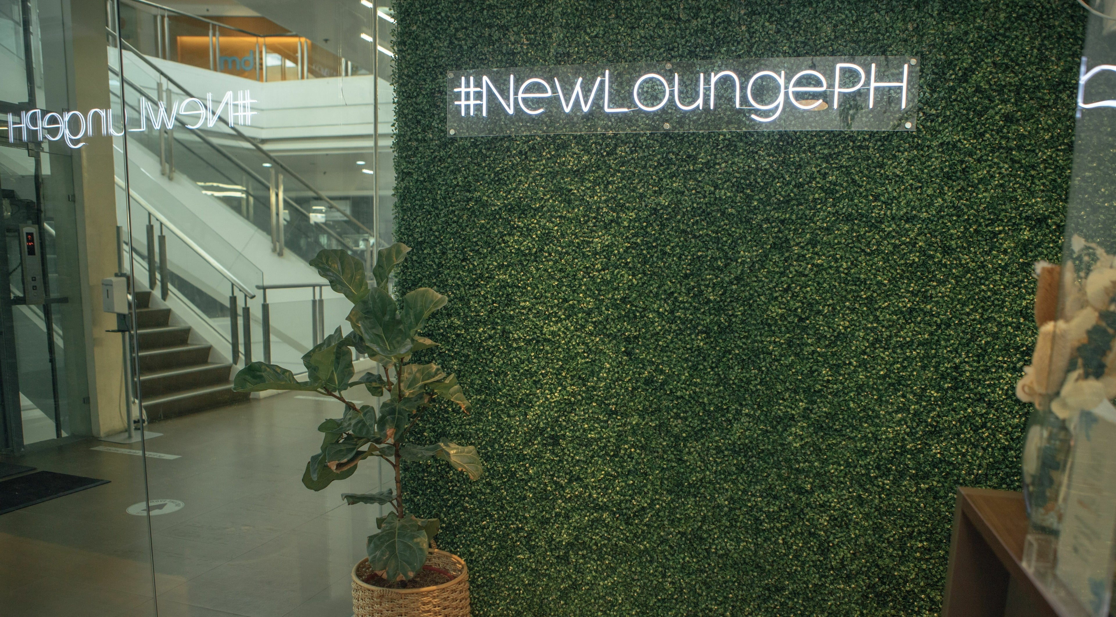Entrance of NEW Lounge Westgate Alabang with greenery wall sign in Muntinlupa, Metro Manila, PH.