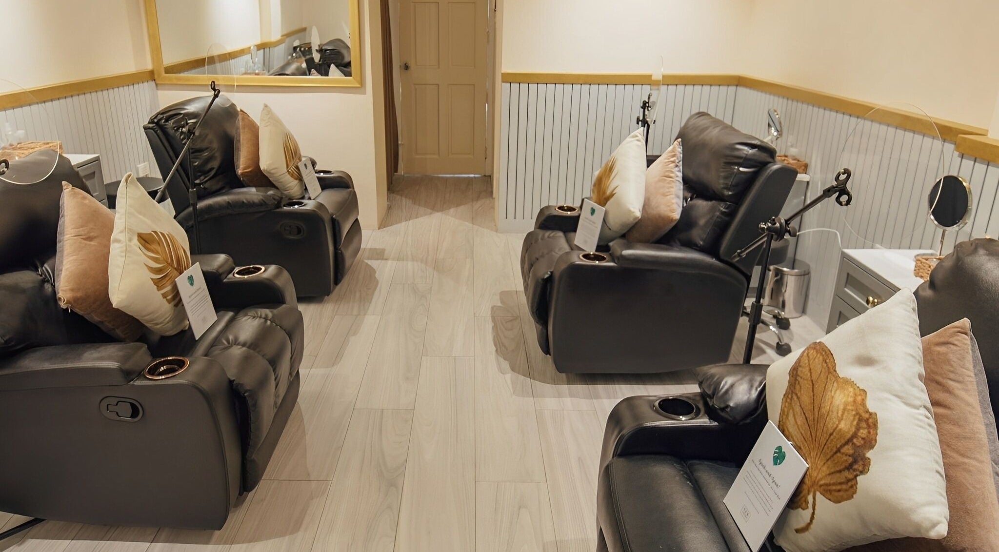 Relaxing massage chairs at NEW Lounge Glorietta in Makati, Metro Manila, PH, offering a luxurious wellness experience.