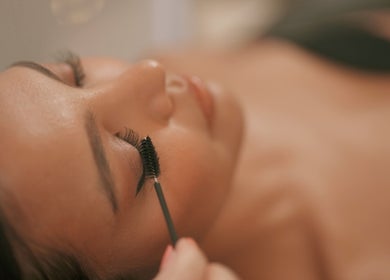 Expert applying eyelash extensions at NEW Lounge Boracay in Aklan, PH, enhancing natural beauty.