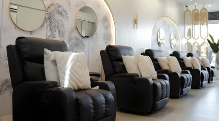 Sleek black chairs and plush pillows at NEW Lounge Sta Rosa, Santa Rosa, Calabarzon, PH.