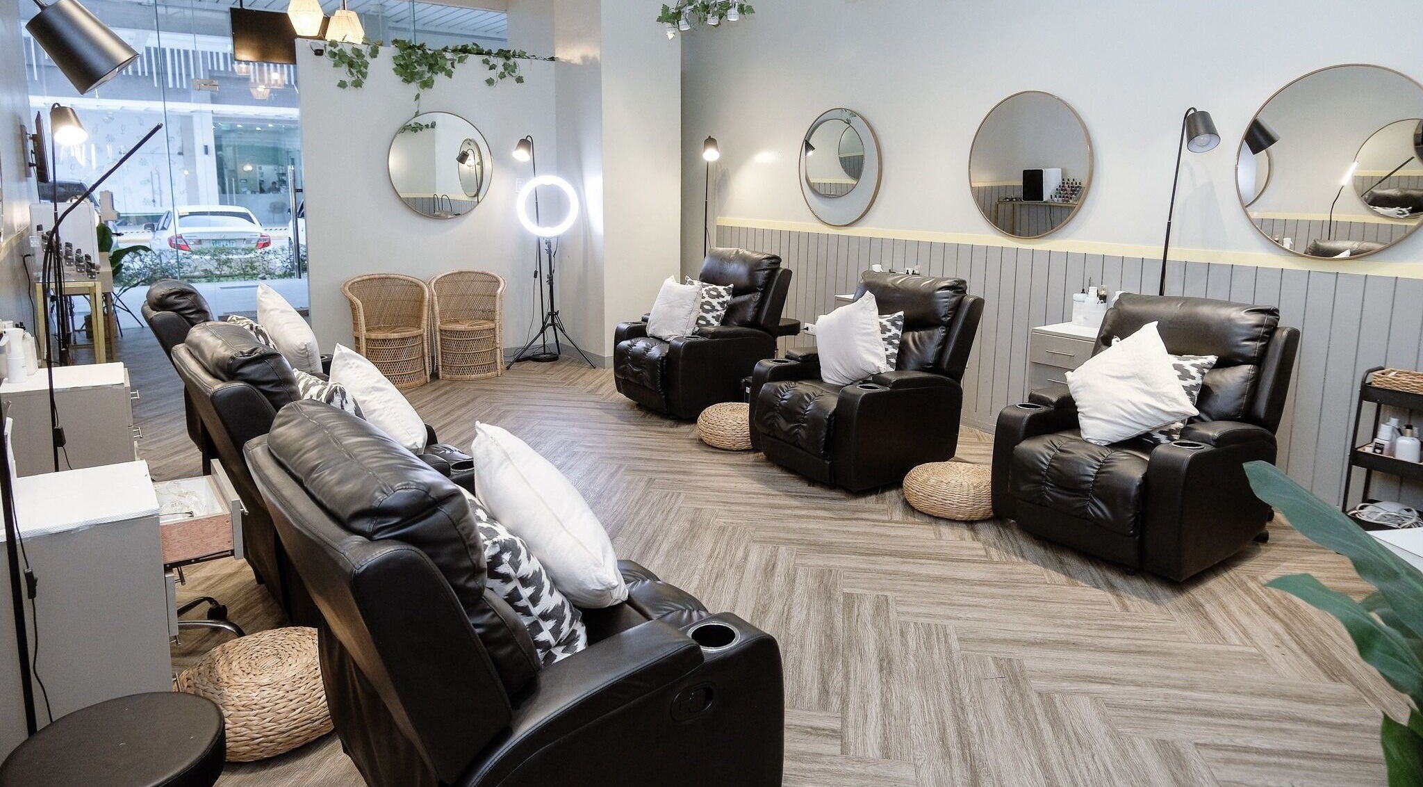 Relaxing interior of NEW Lounge Cebu in Cebu, PH with plush seating and elegant mirrors.