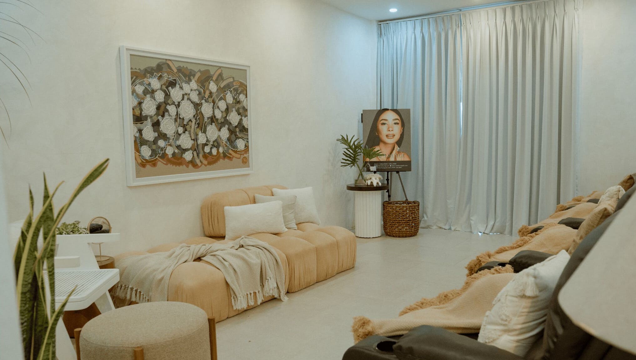 Elegant interior of NEW Lounge La Union, Bacnotan, Ilocos Region, PH with plush seating and artwork.