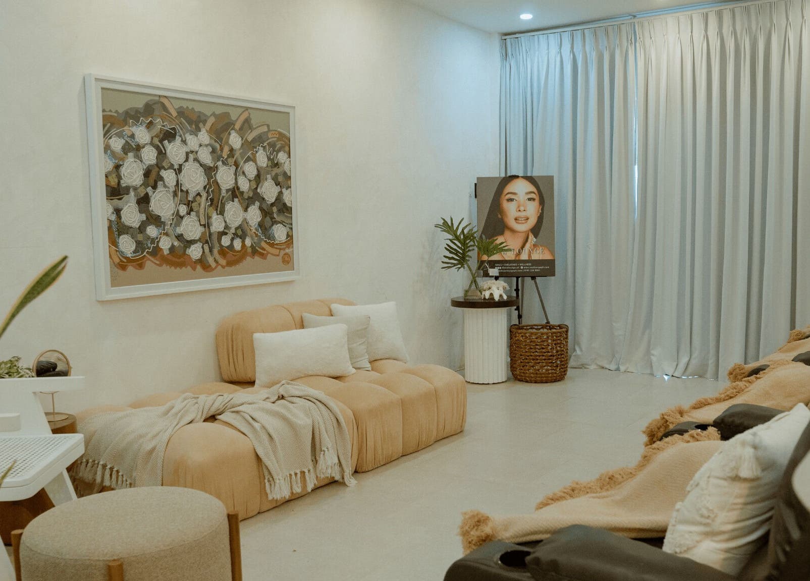 Elegant interior of NEW Lounge La Union, Bacnotan, Ilocos Region, PH with plush seating and artwork.