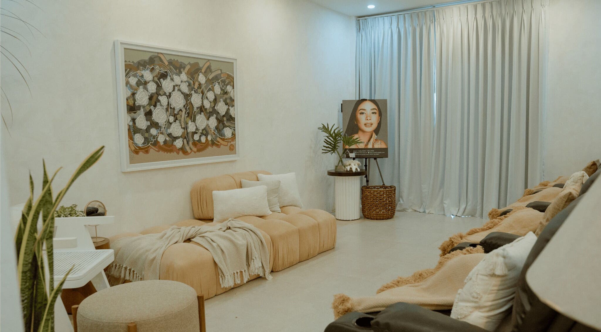 Elegant interior of NEW Lounge La Union, Bacnotan, Ilocos Region, PH with plush seating and artwork.