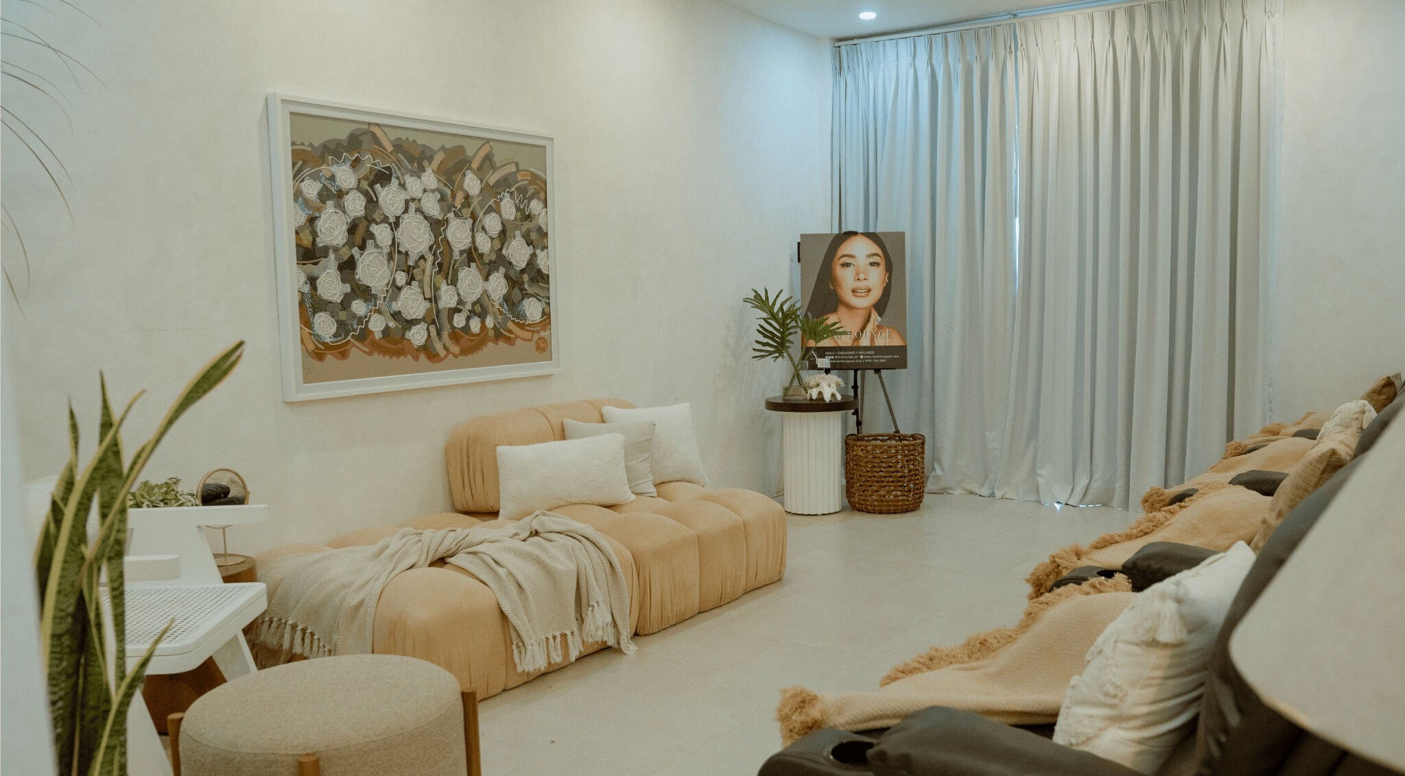 Elegant interior of NEW Lounge La Union, Bacnotan, Ilocos Region, PH with plush seating and artwork.