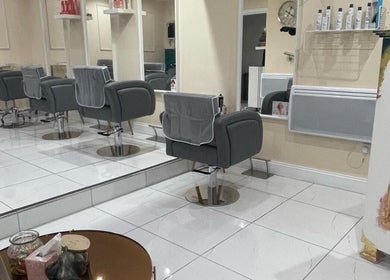 Modern salon chairs and mirrors at Chantelle Douglas Hairdressing in Falkirk, Scotland, GB.