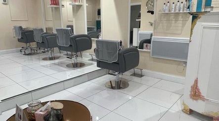 Modern salon chairs and mirrors at Chantelle Douglas Hairdressing in Falkirk, Scotland, GB.