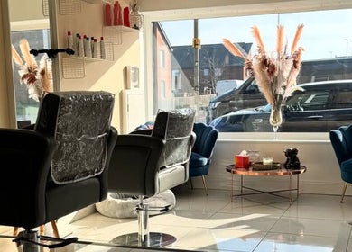 Modern salon interior at Chantelle Douglas Hairdressing, Falkirk, Scotland, GB with stylish decor and seating.