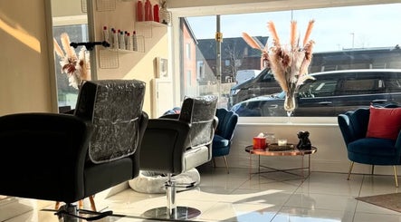 Modern salon interior at Chantelle Douglas Hairdressing, Falkirk, Scotland, GB with stylish decor and seating.