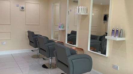 Chic interior of Chantelle Douglas Hairdressing, Falkirk, Scotland, GB featuring sleek styling chairs and mirrors.