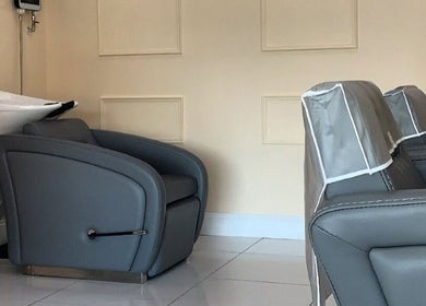 Stylish salon chairs at Chantelle Douglas Hairdressing in Falkirk, Scotland, GB for a luxurious experience.