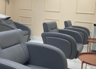 Chic grey salon chairs at Chantelle Douglas Hairdressing in Falkirk, Scotland, GB.