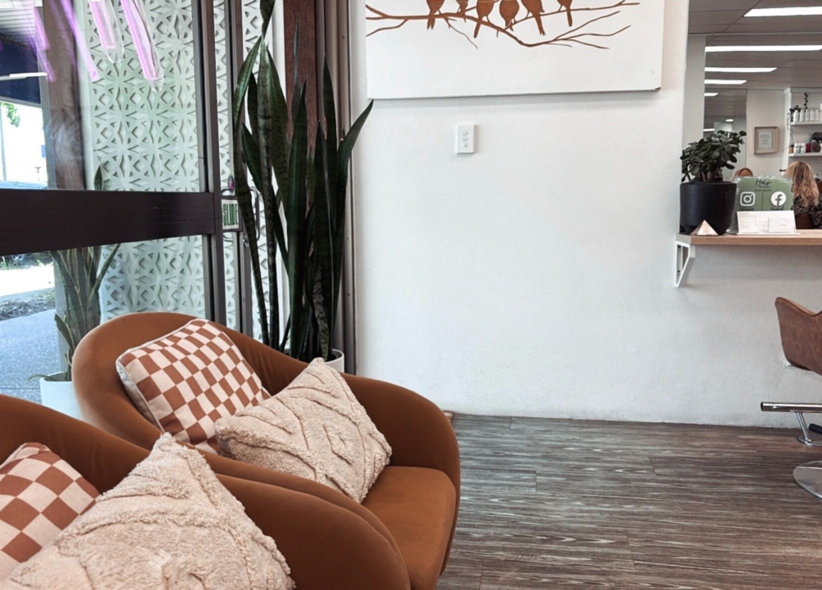 Cozy seating at Hair by Cesca, Mooloolaba, Queensland, AU with modern decor and natural light.